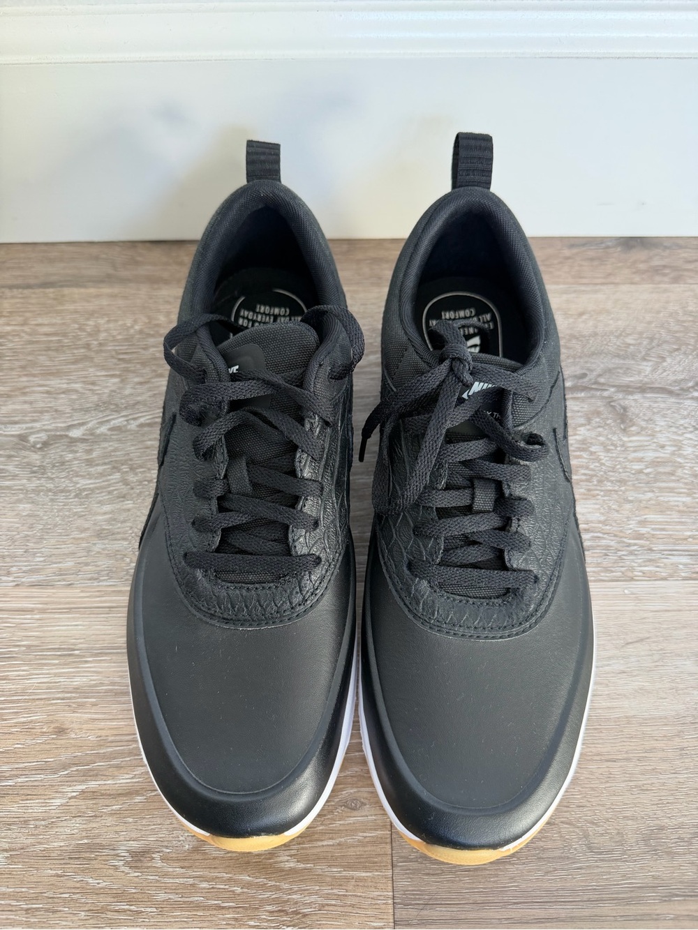 Nike Women’s Black Sneakers with White Midsole and Gum Toe Accent